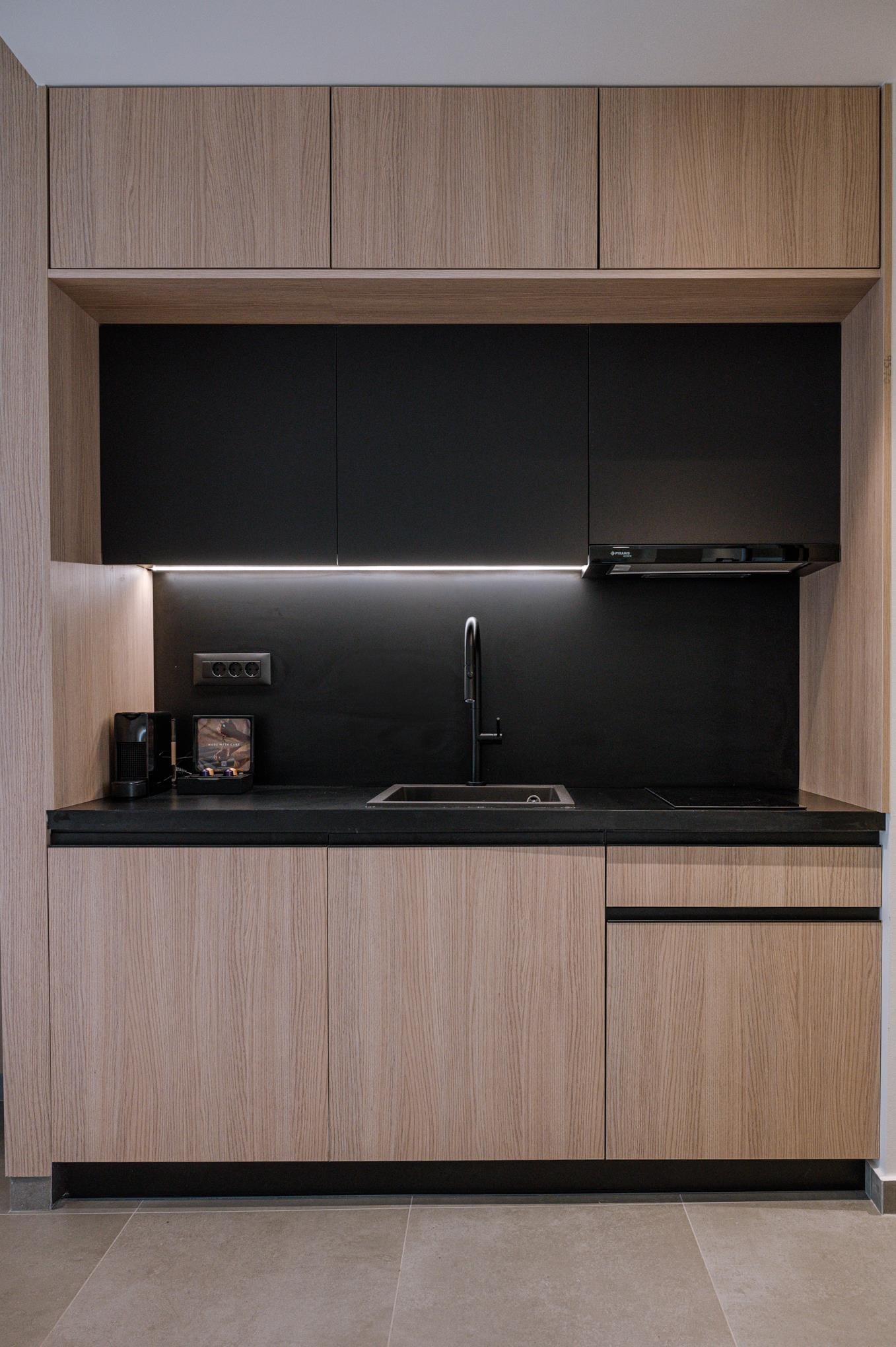 a kitchen with a black countertop
