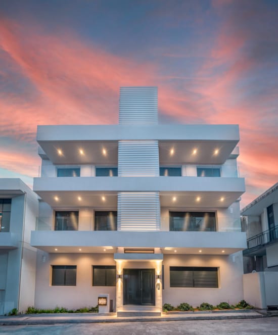 a building with a rainbow in the background