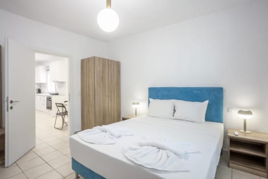 a bedroom with a bed and a desk