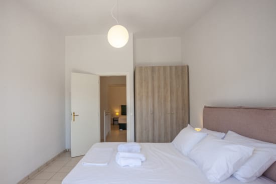 a hotel room with a bed and a light