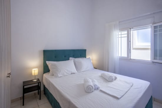 a bed with white sheets