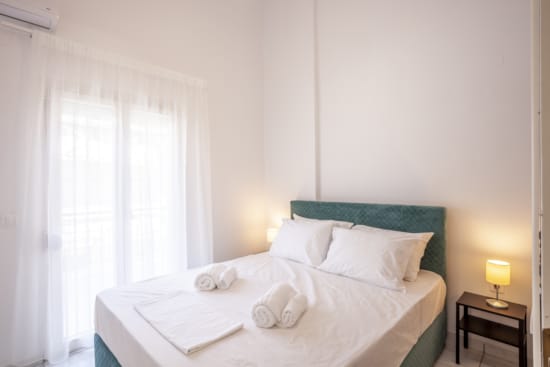 a bed with white sheets