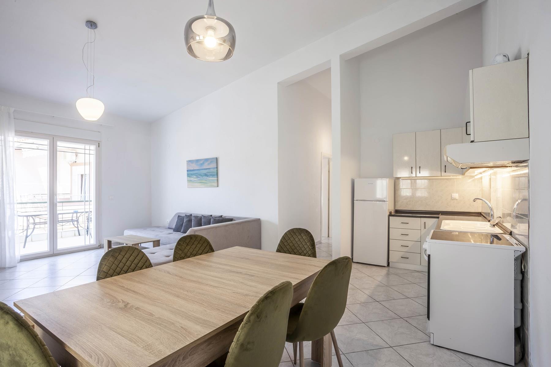 a kitchen with a table and chairs