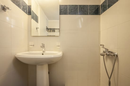 a bathroom with a sink and mirror
