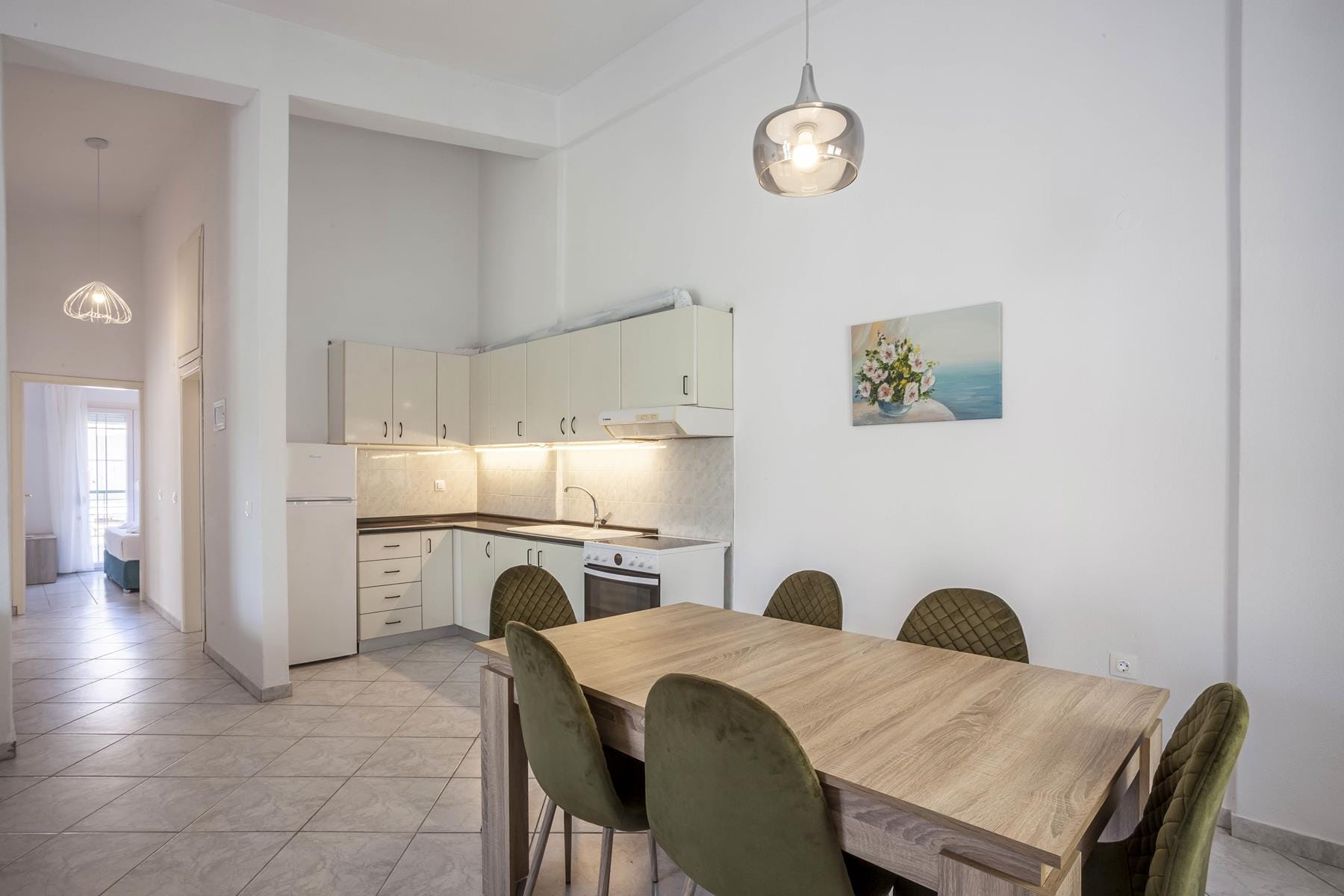 a dining room with a table and chairs