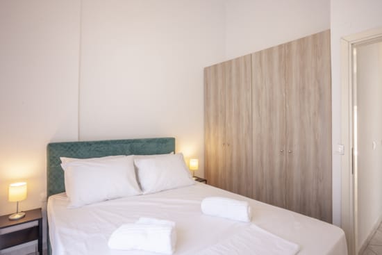 a bed with white sheets