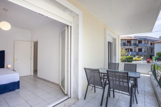 a room with a table chairs and a couch