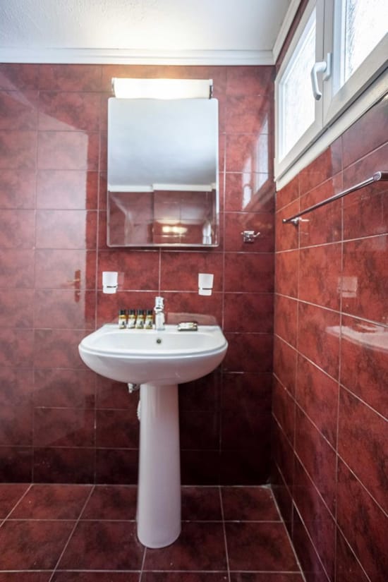a bathroom with a sink and mirror
