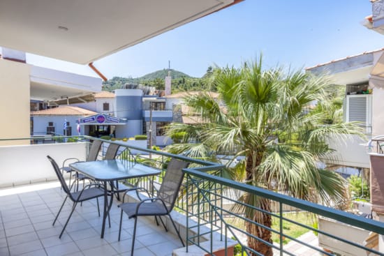 a patio with tables and chairs