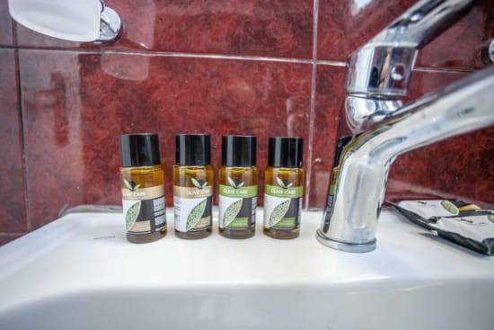 a sink with bottles of soap