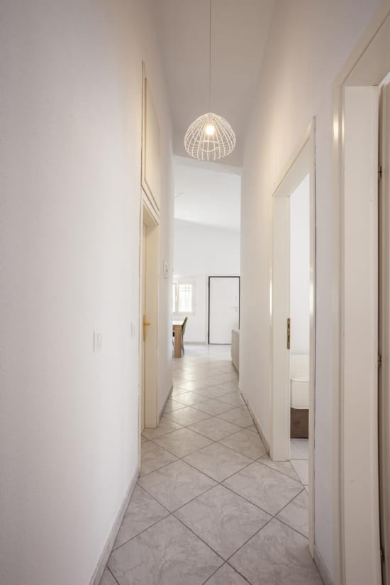 a hallway with white walls