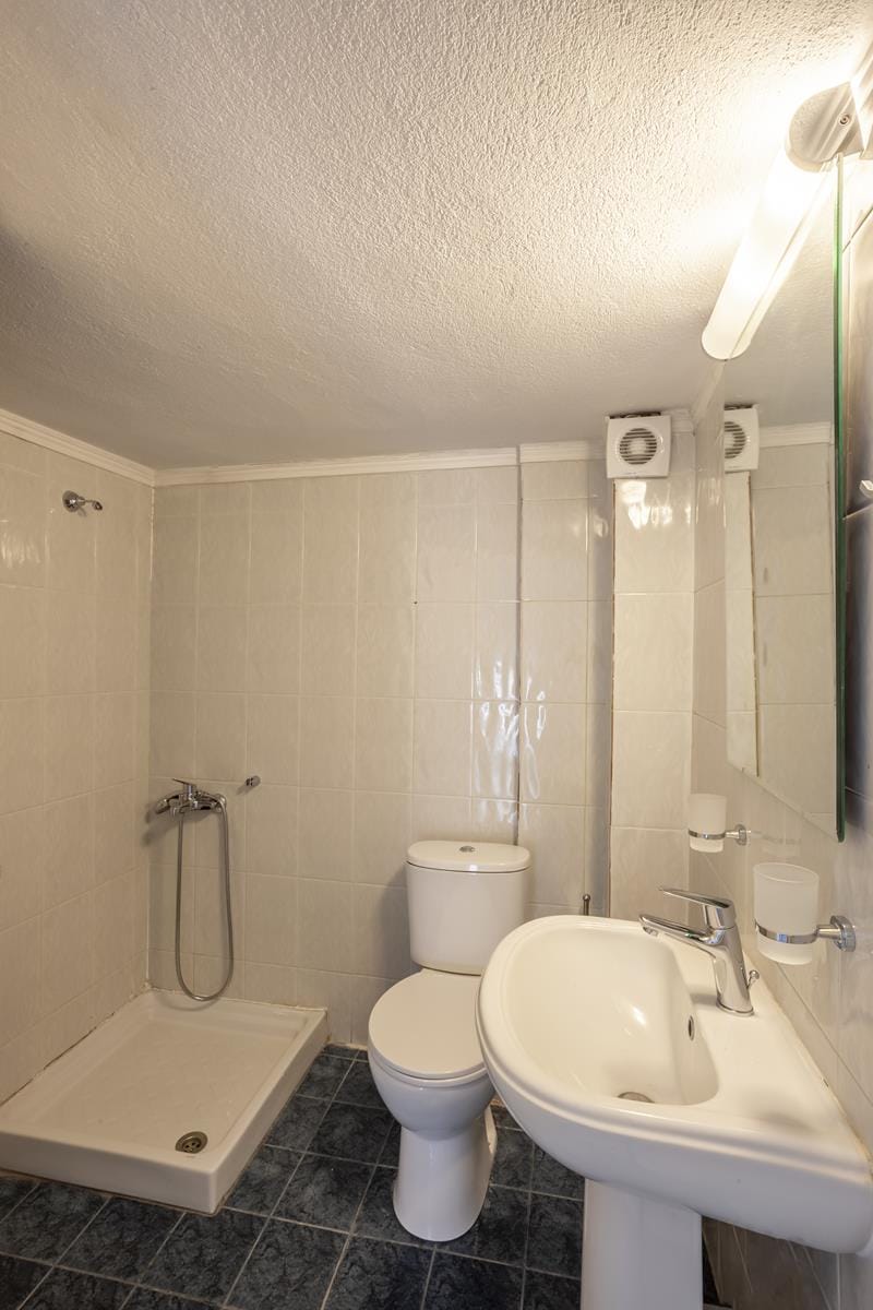 a bathroom with a toilet sink and a bathtub