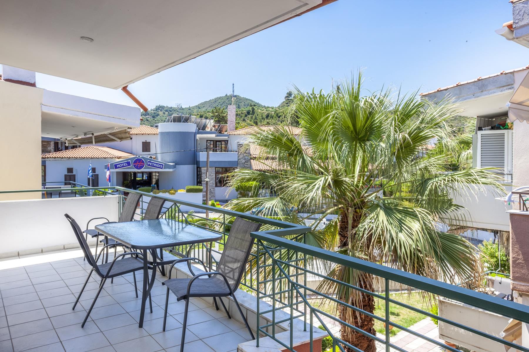 a patio with tables and chairs