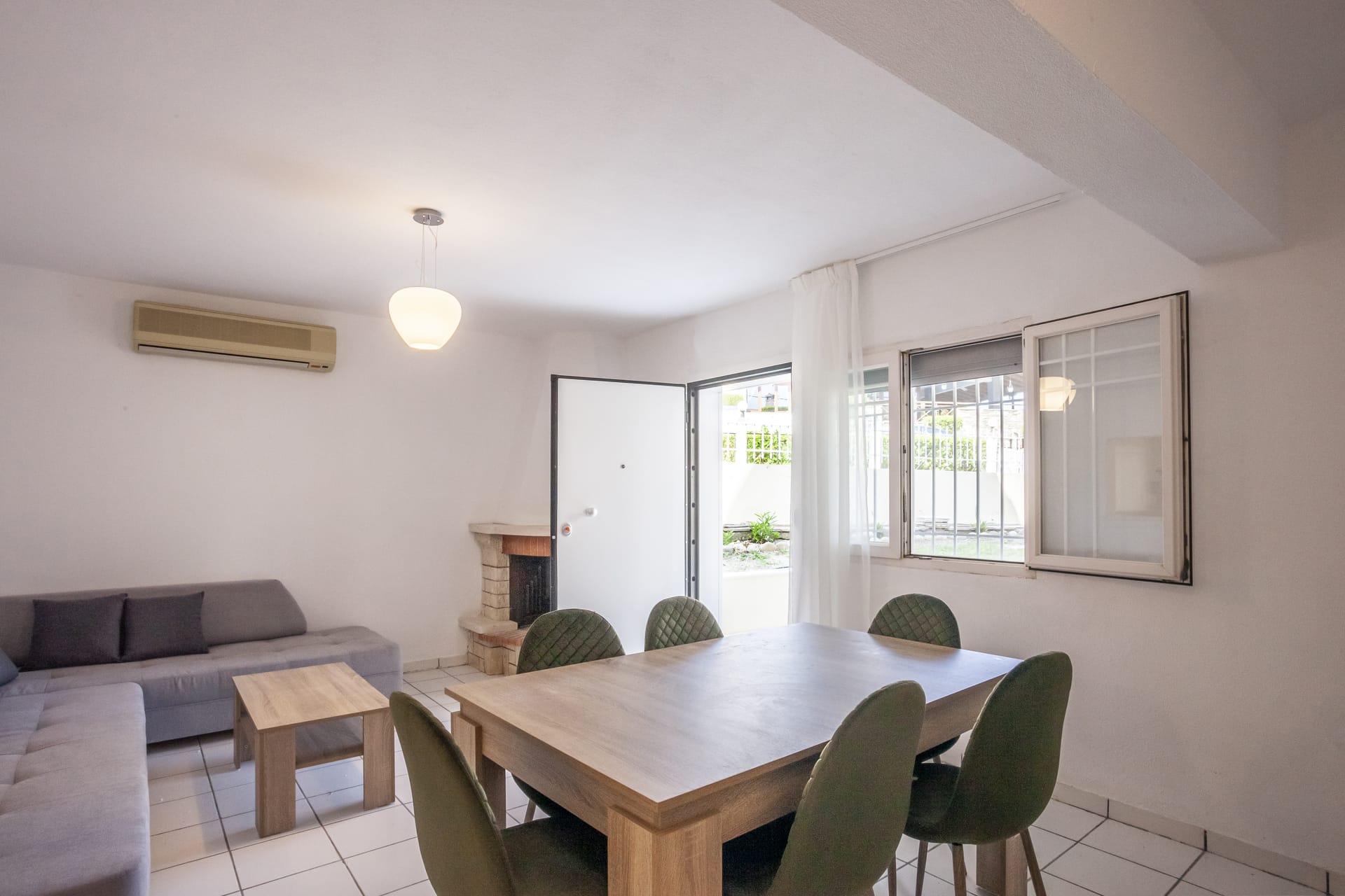 a room with a table and chairs