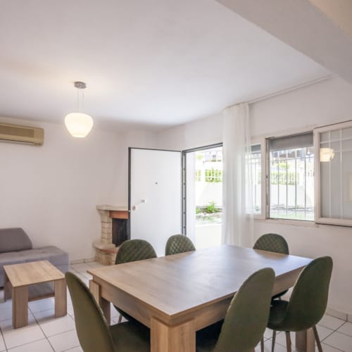 a room with a table and chairs