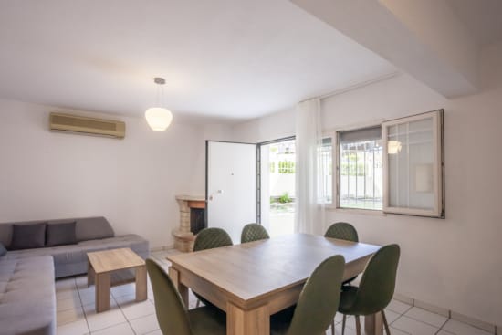 a room with a table and chairs