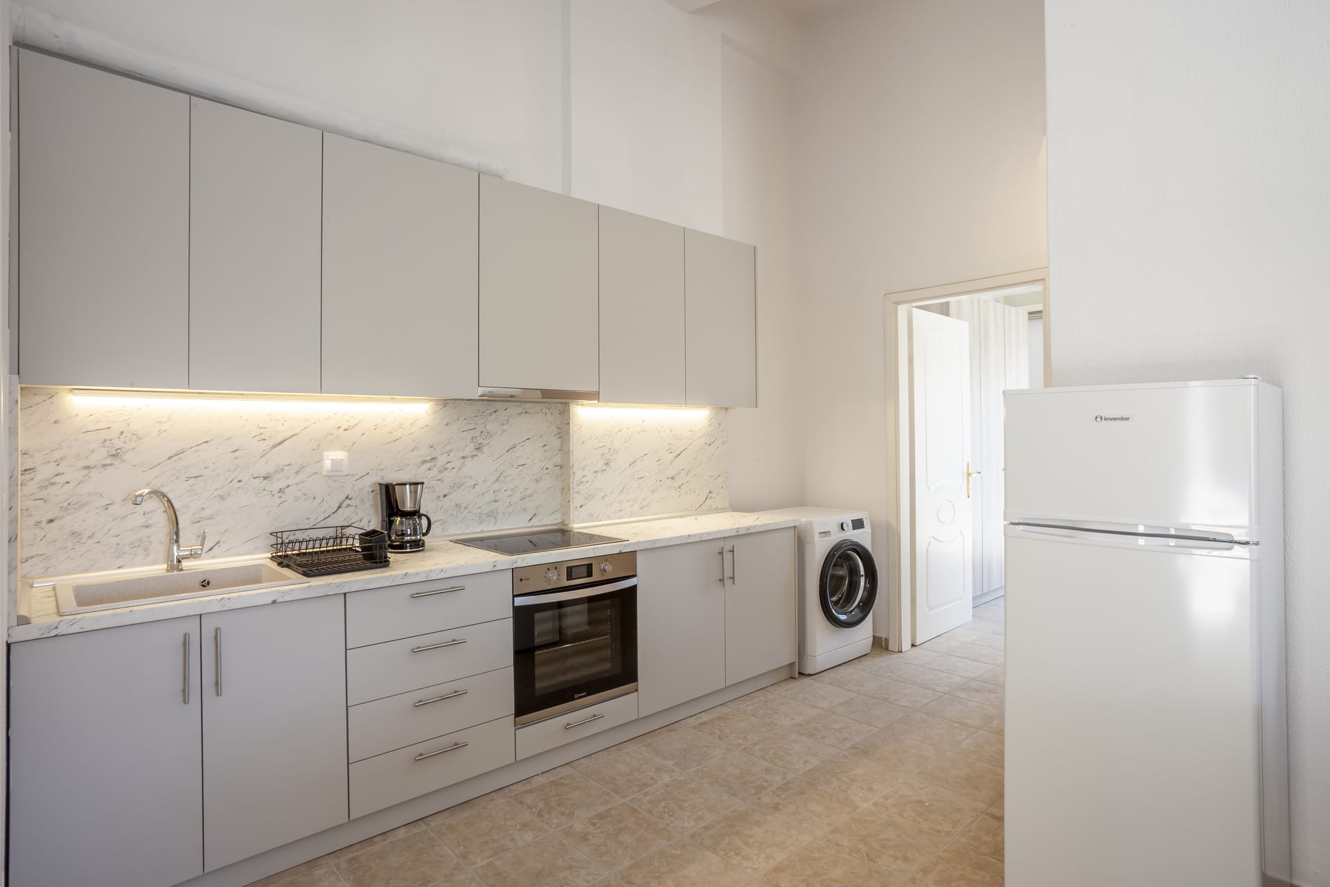 a kitchen with white cabinets