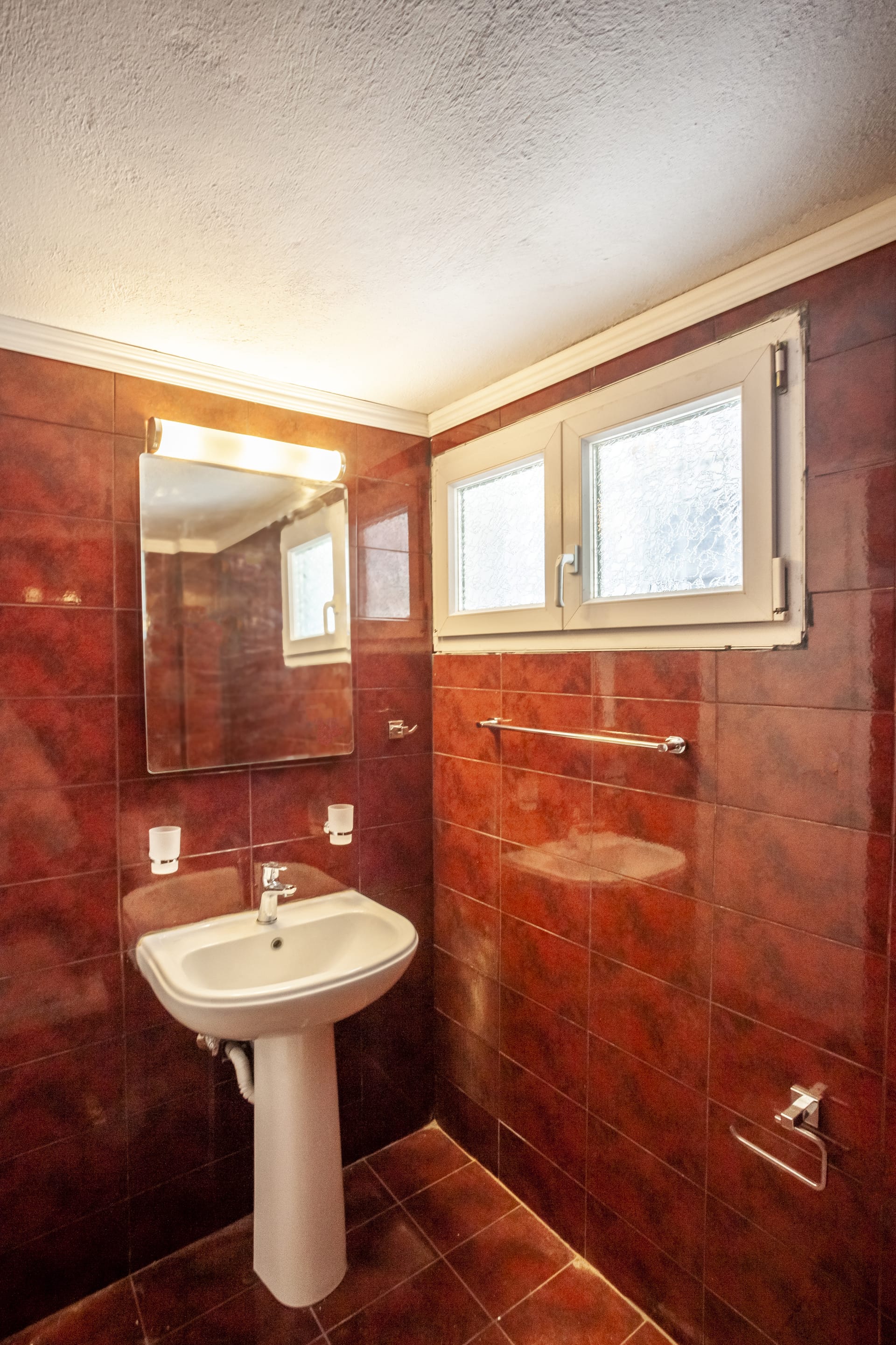 a bathroom with a sink and mirror