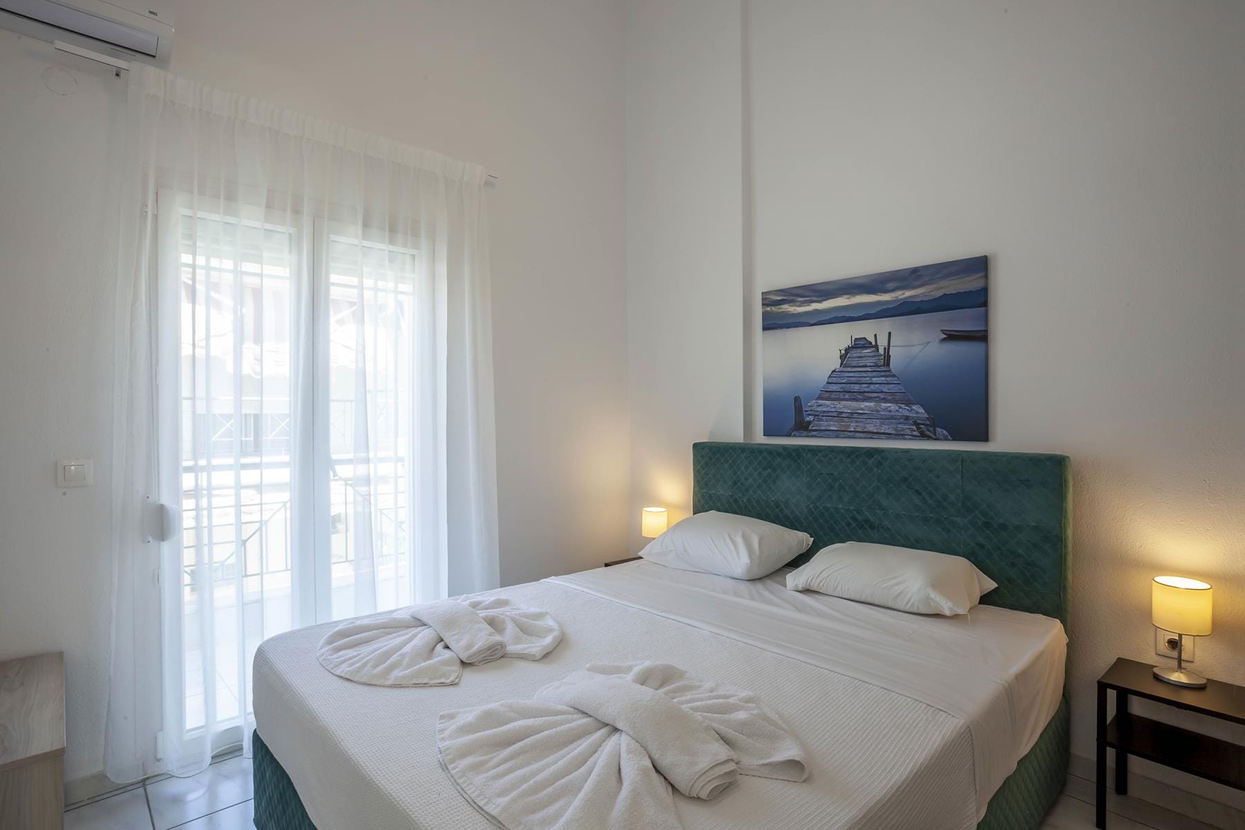 a bed with white sheets