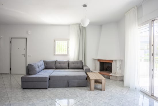 a living room with a couch and a fireplace