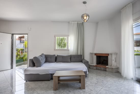 a living room with a couch and a fireplace