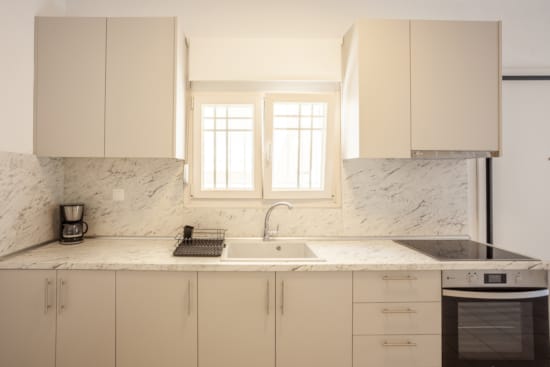 a kitchen with white cabinets