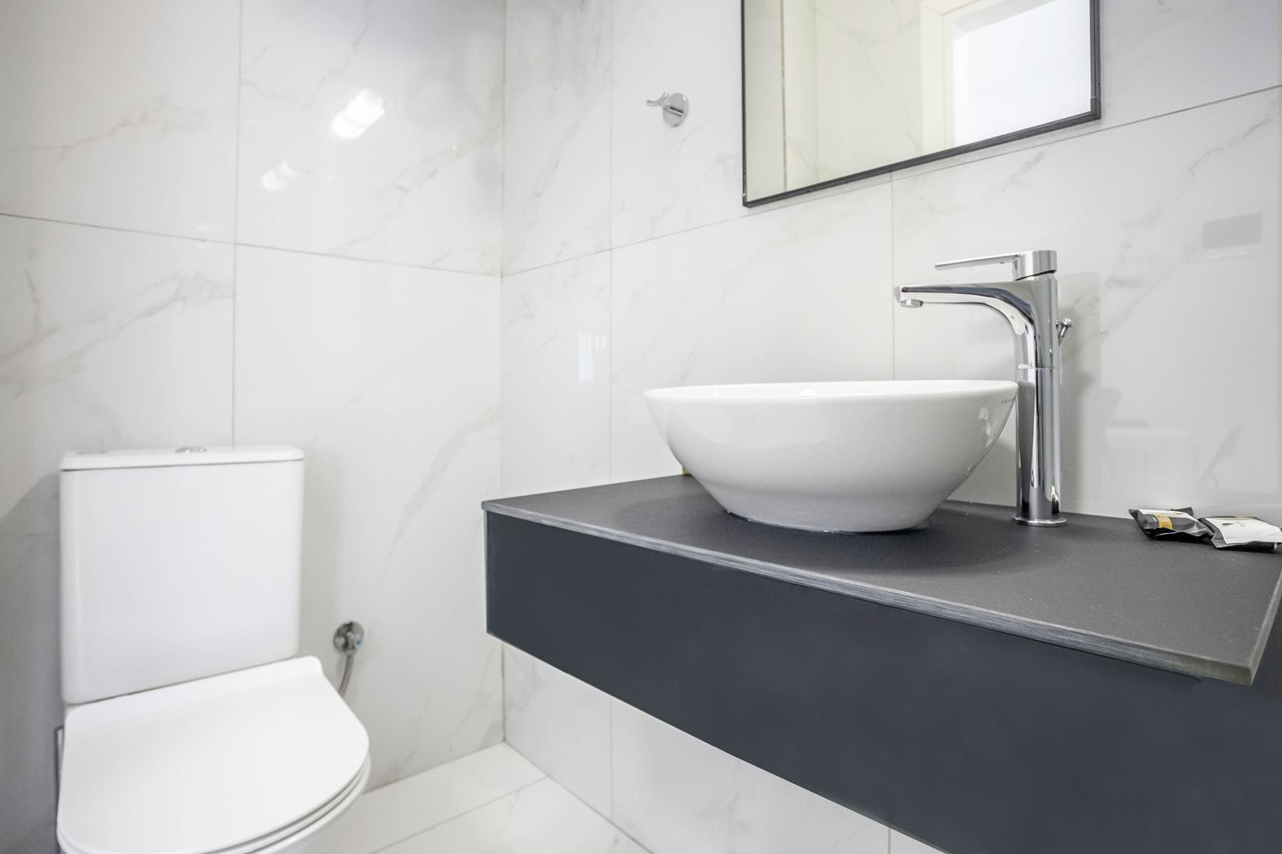 a bathroom with a sink and toilet