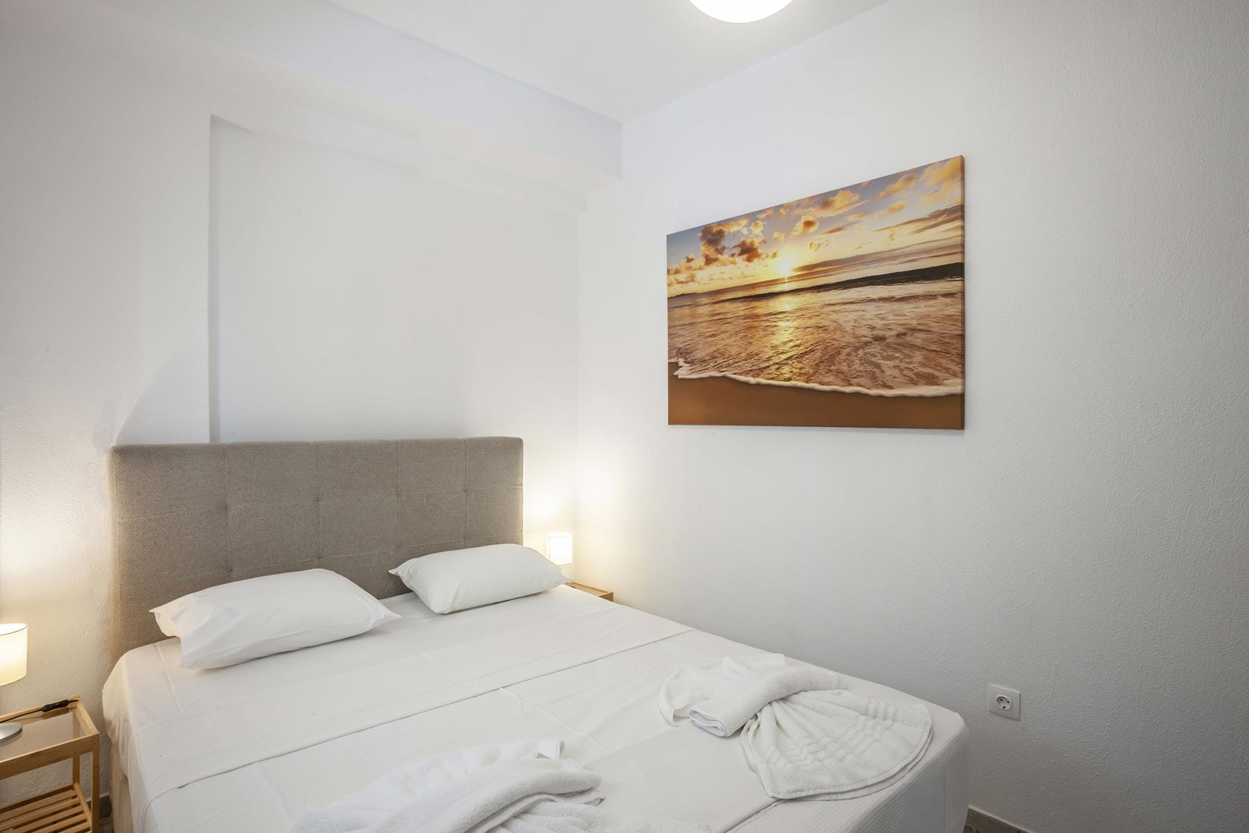 a bed with white sheets