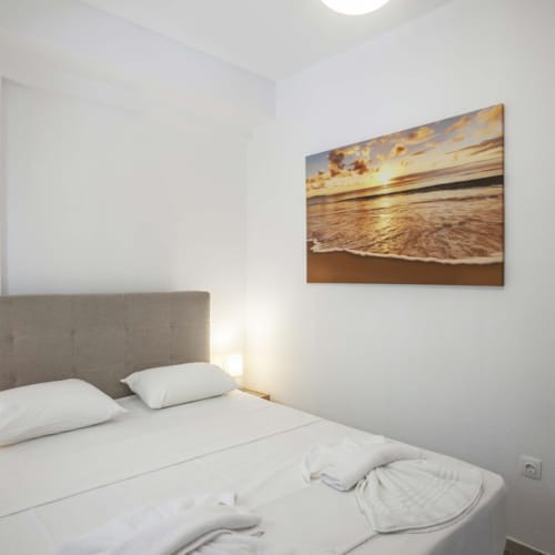 a bed with white sheets