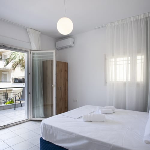 a room with a bed and a window