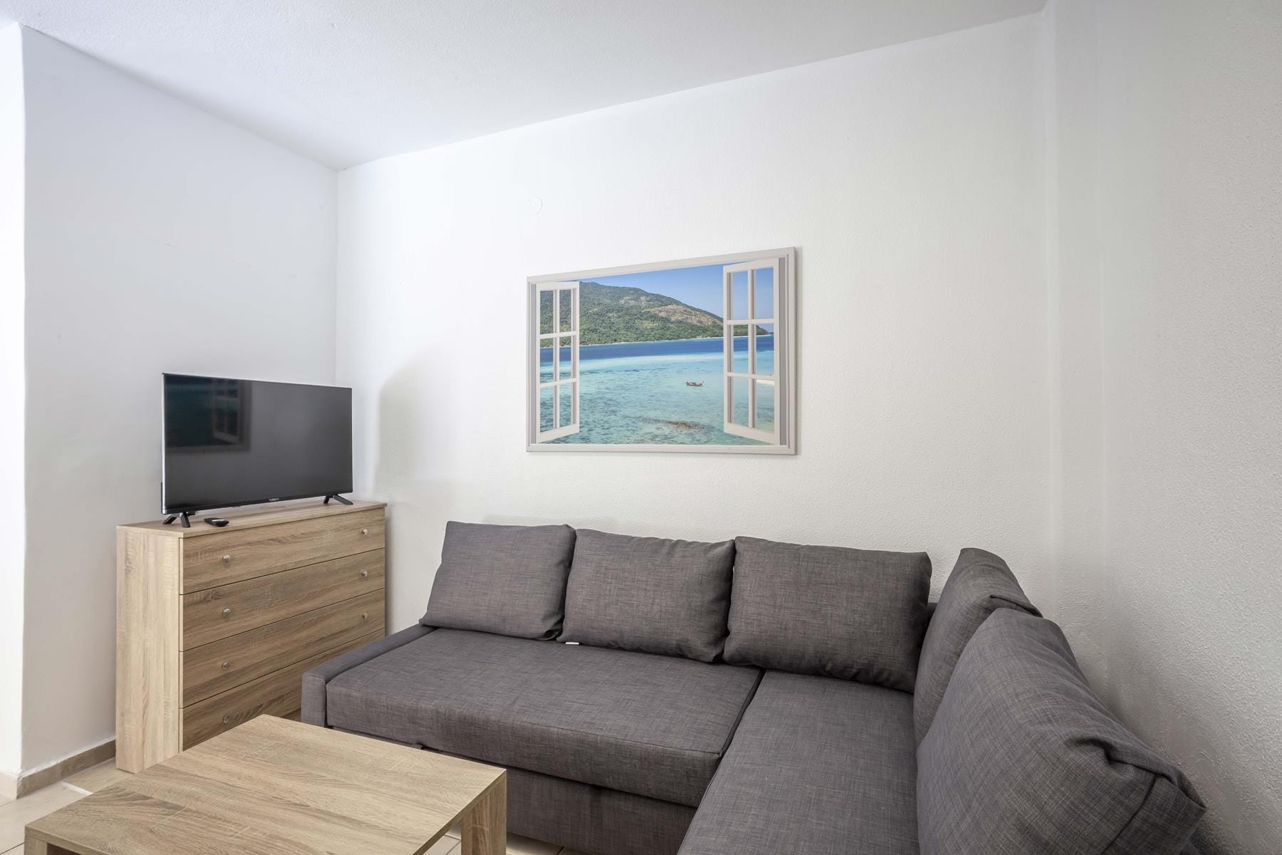 a living room with a couch and a television