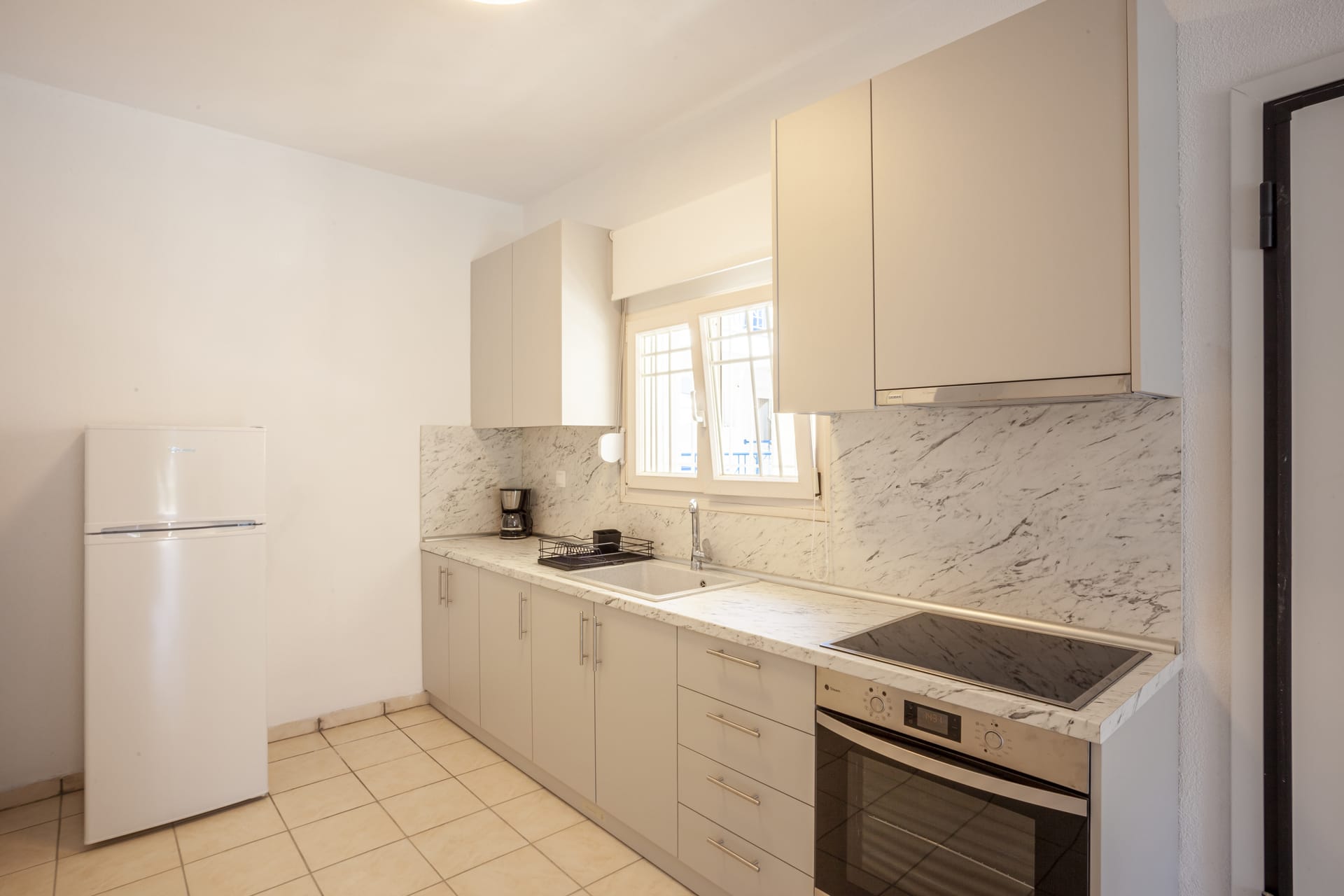a kitchen with white cabinets