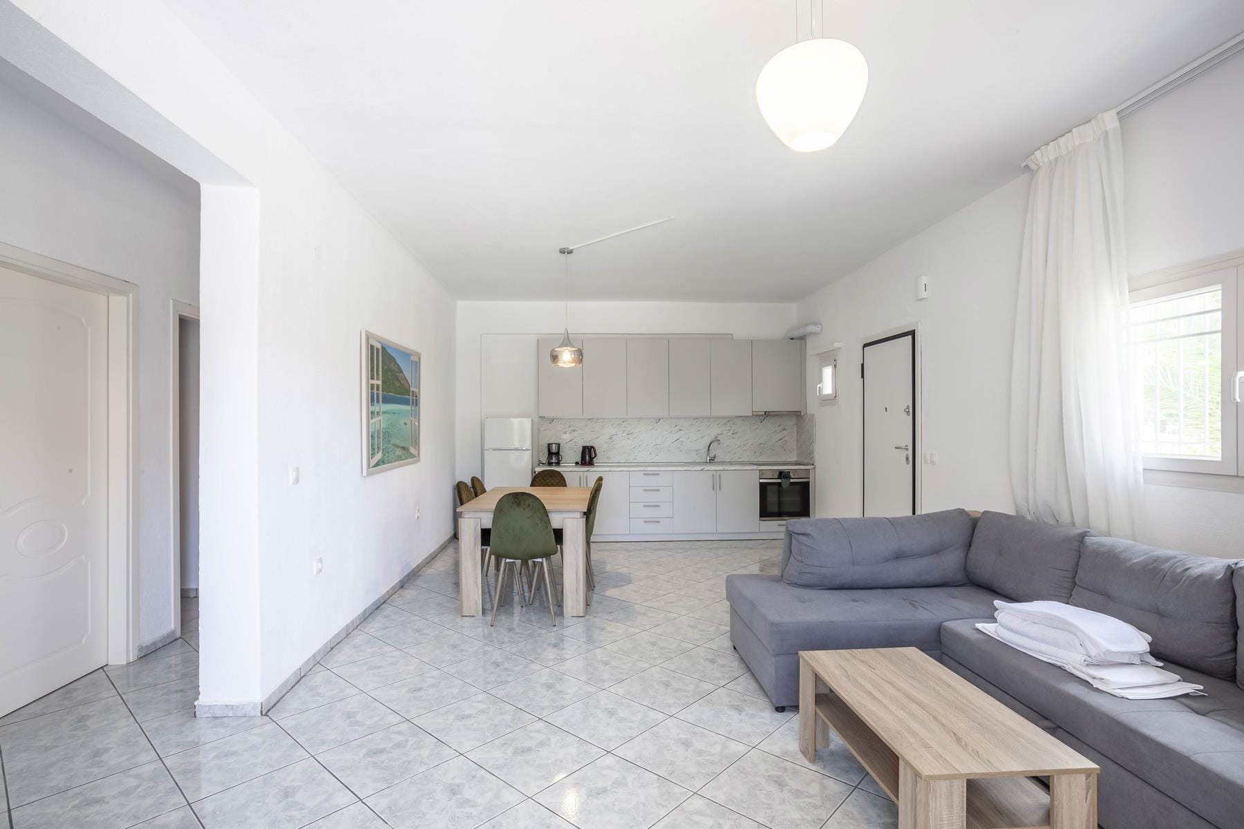 a living room with a couch and a table