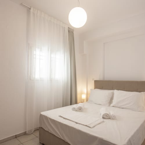 a bed with white sheets
