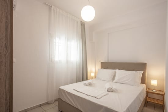 a bed with white sheets