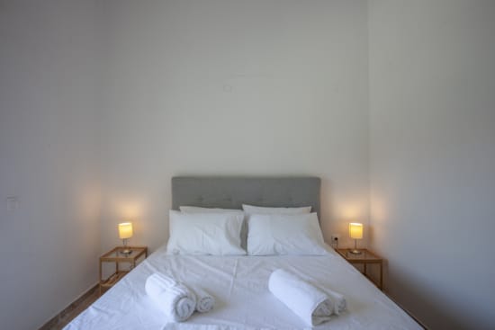 a bed with white sheets