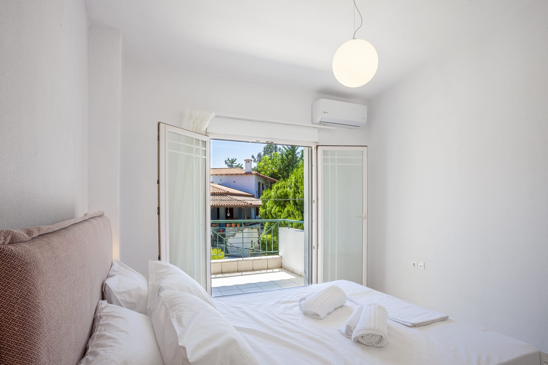 a room with a bed and a window