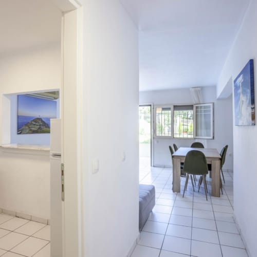 a room with a table and chairs