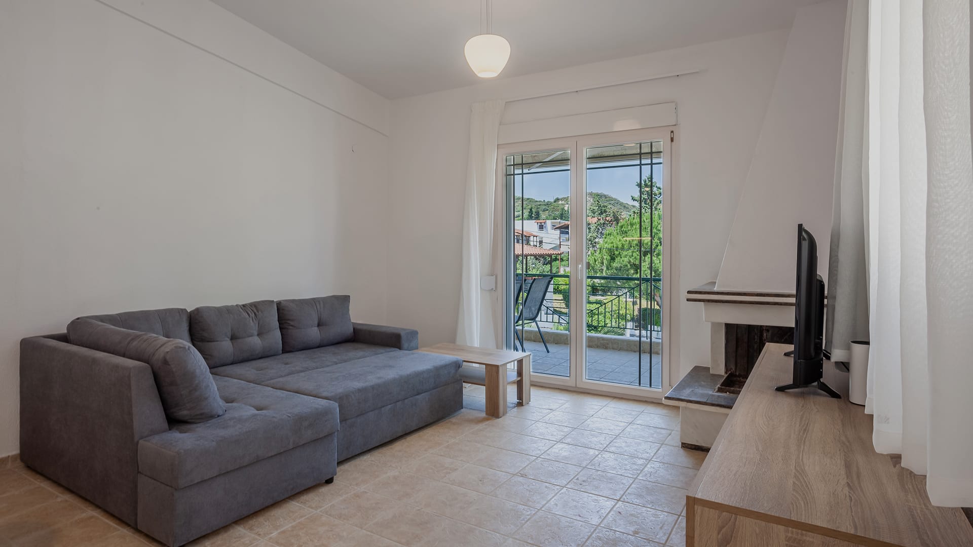 a living room with a large glass door