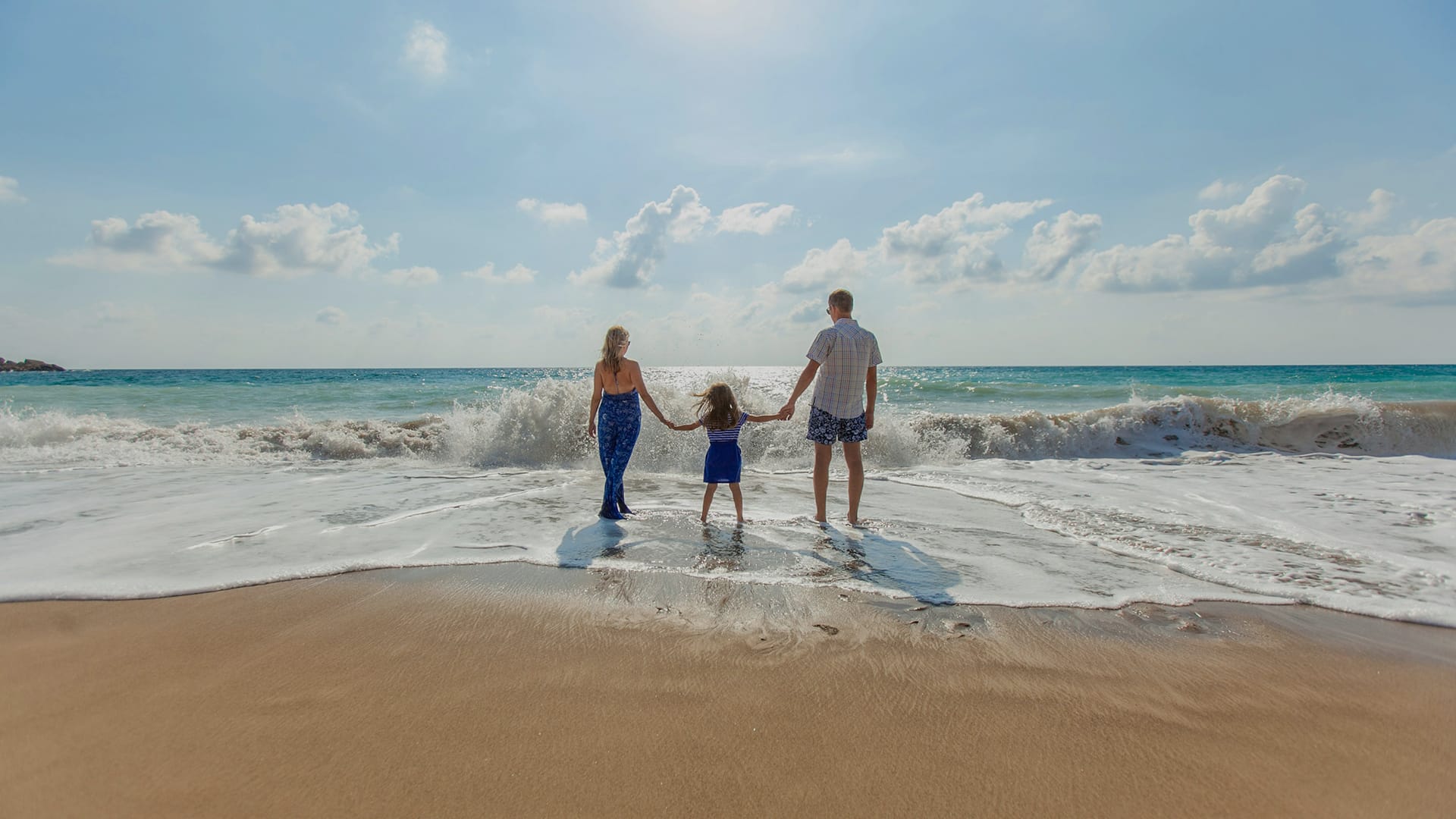a family walking on the beach