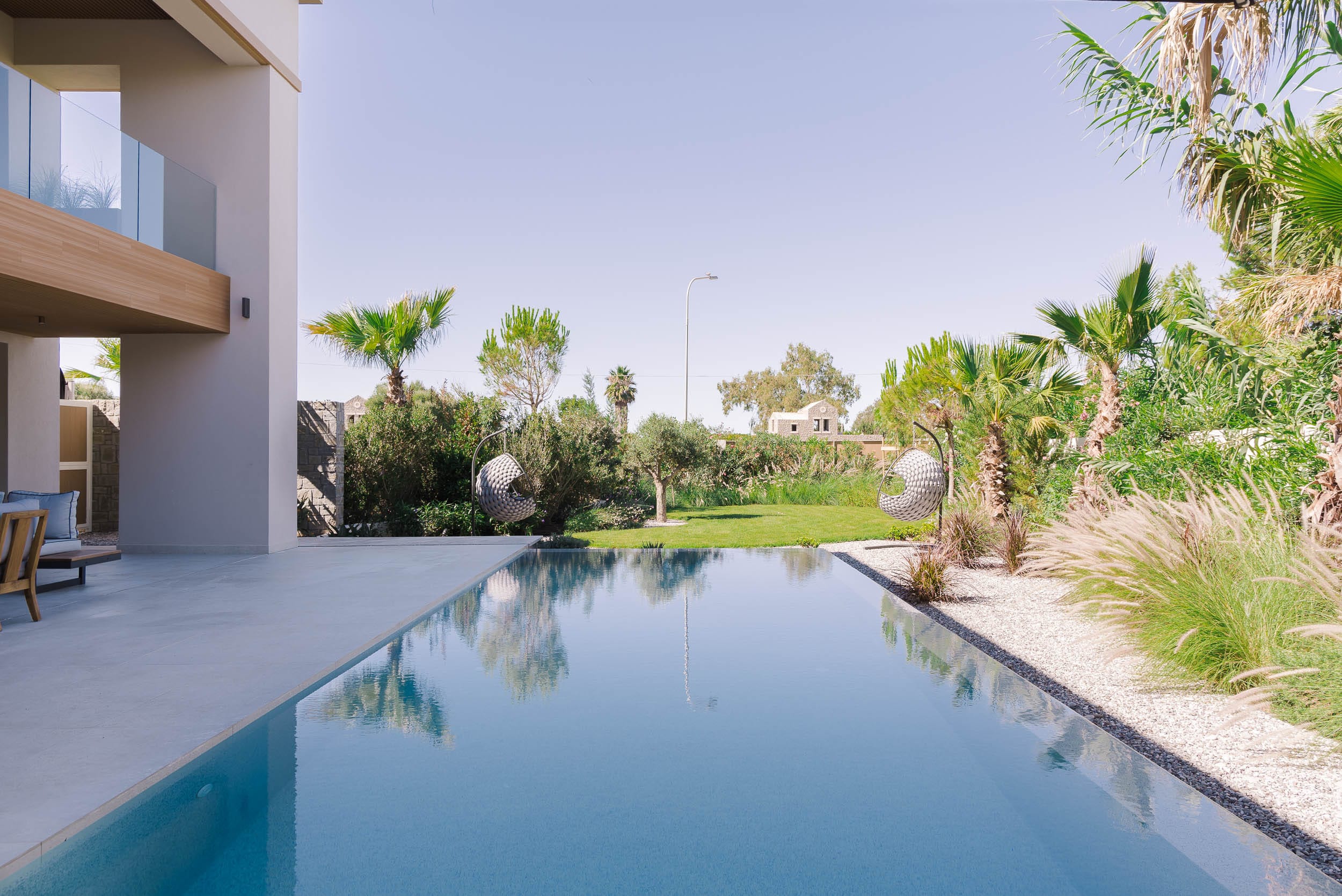 a pool with trees around it