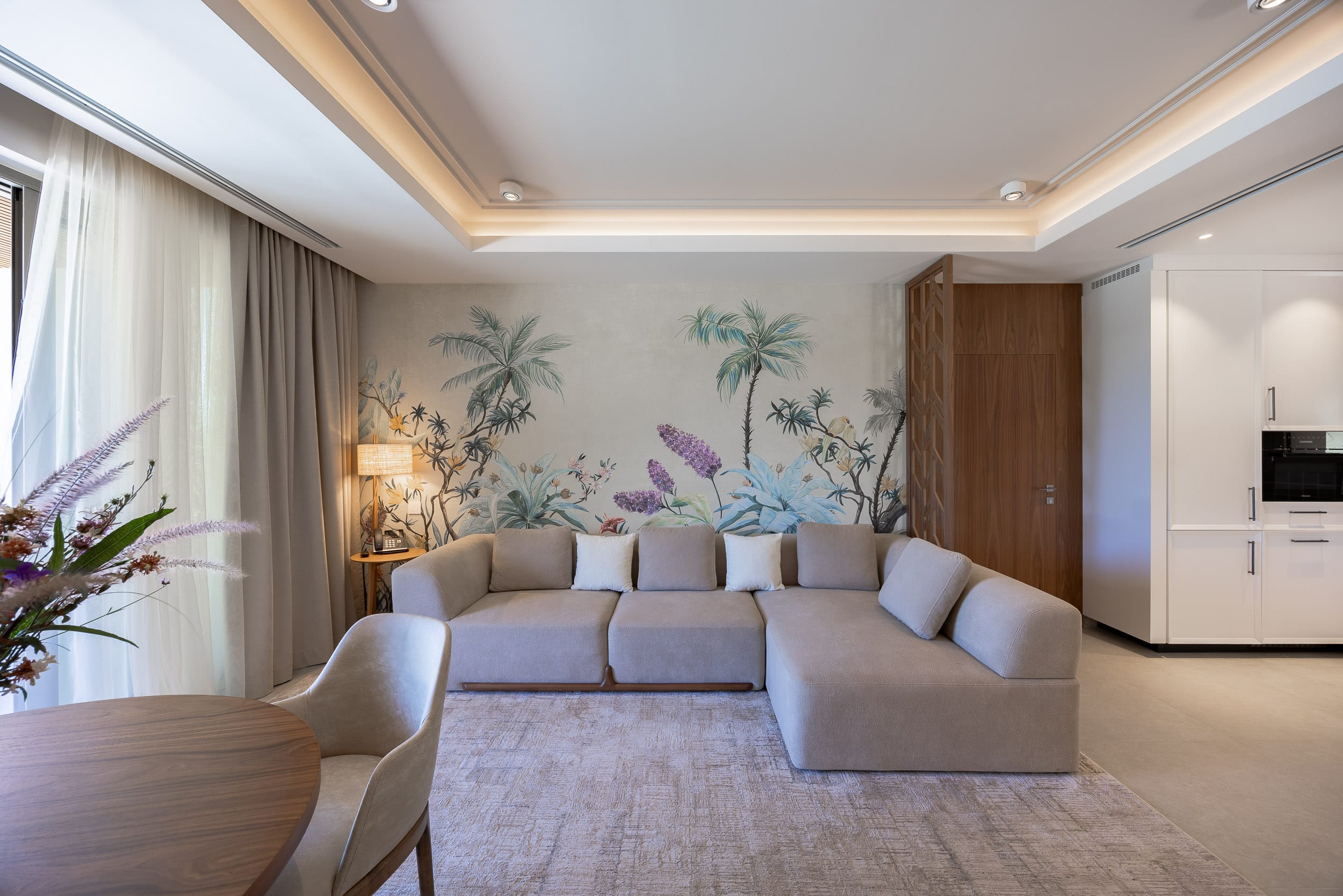 a living room with a couch and chairs