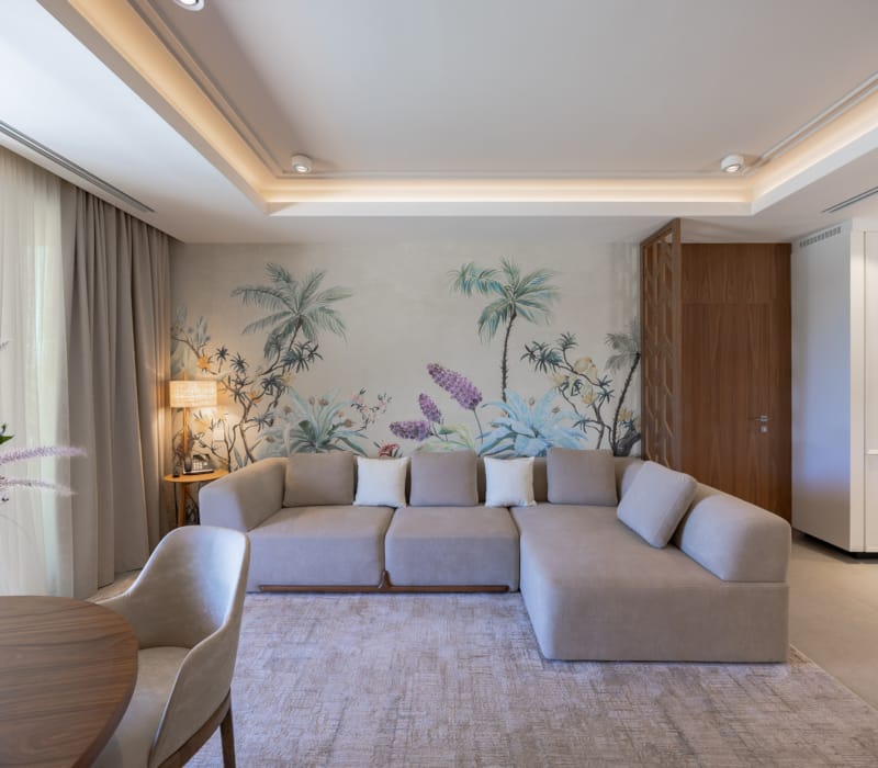 a living room with a couch and chairs