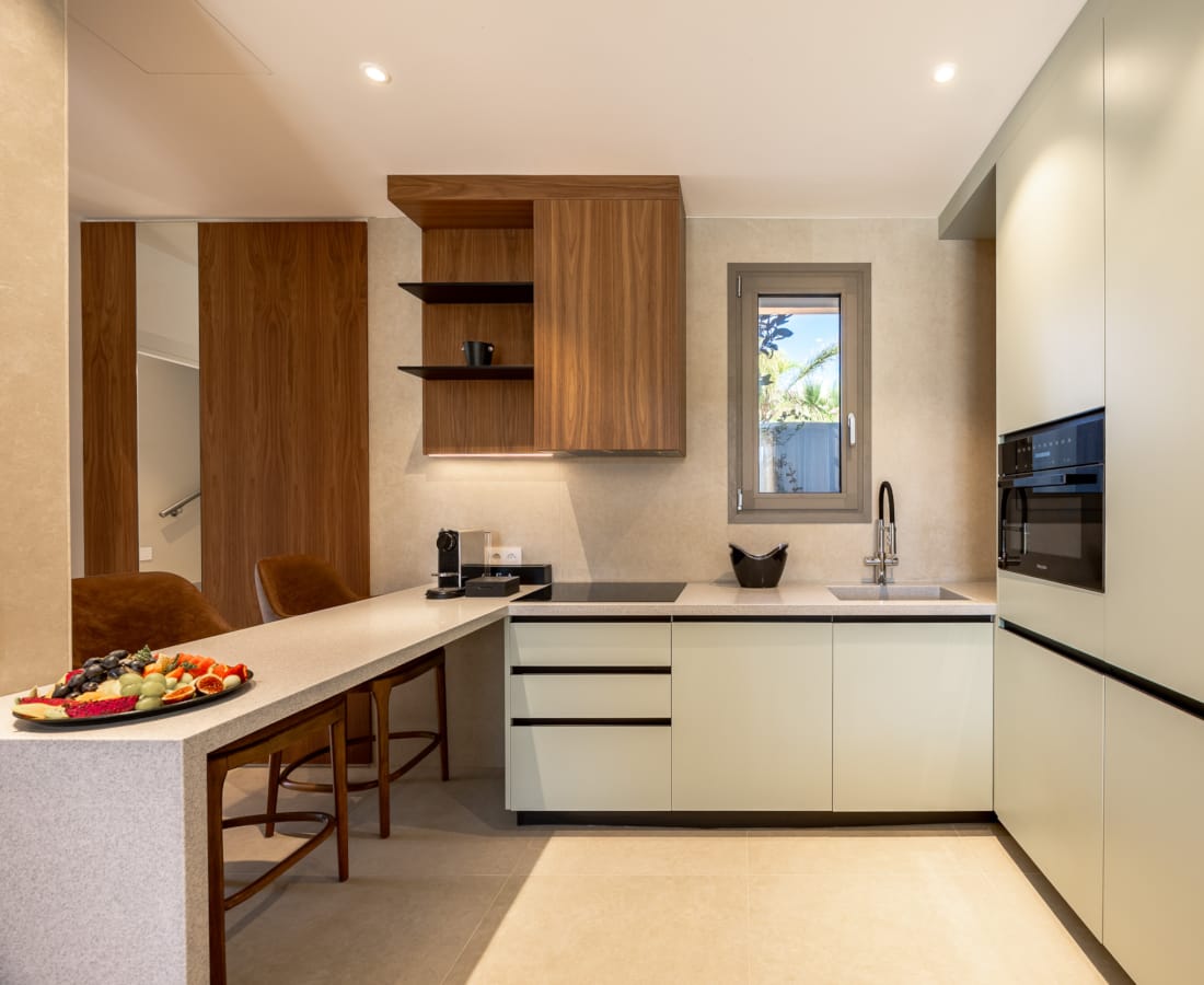 a kitchen with white cabinets