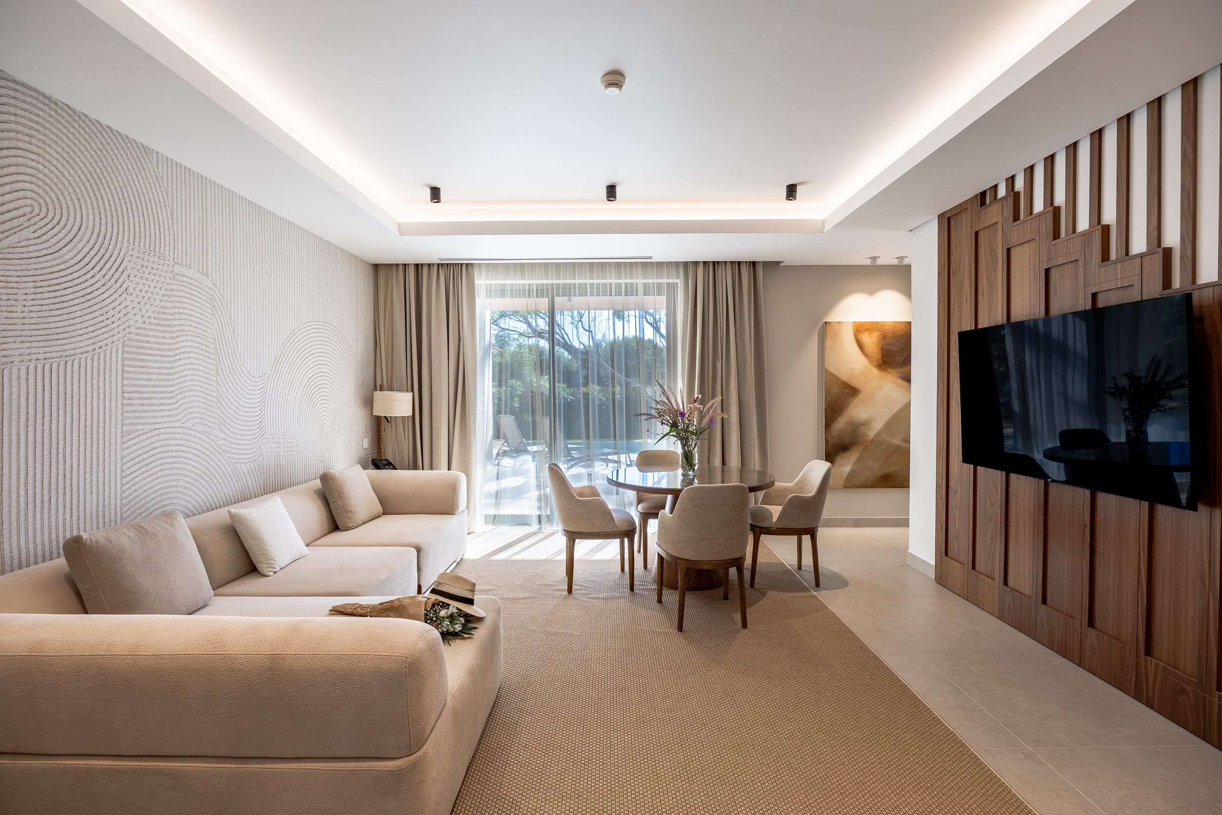 a living room with a tv and couches