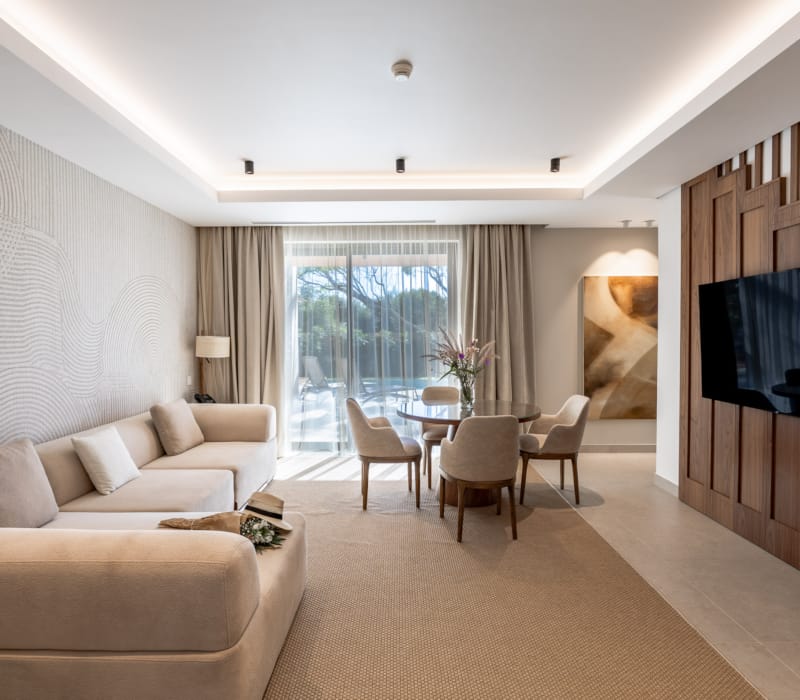 a living room with a tv and couches