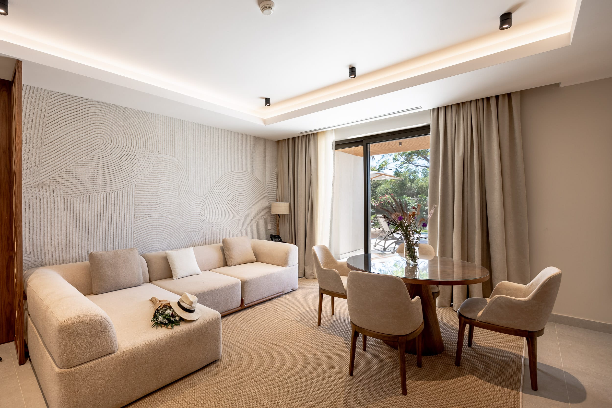 a living room with a table and chairs