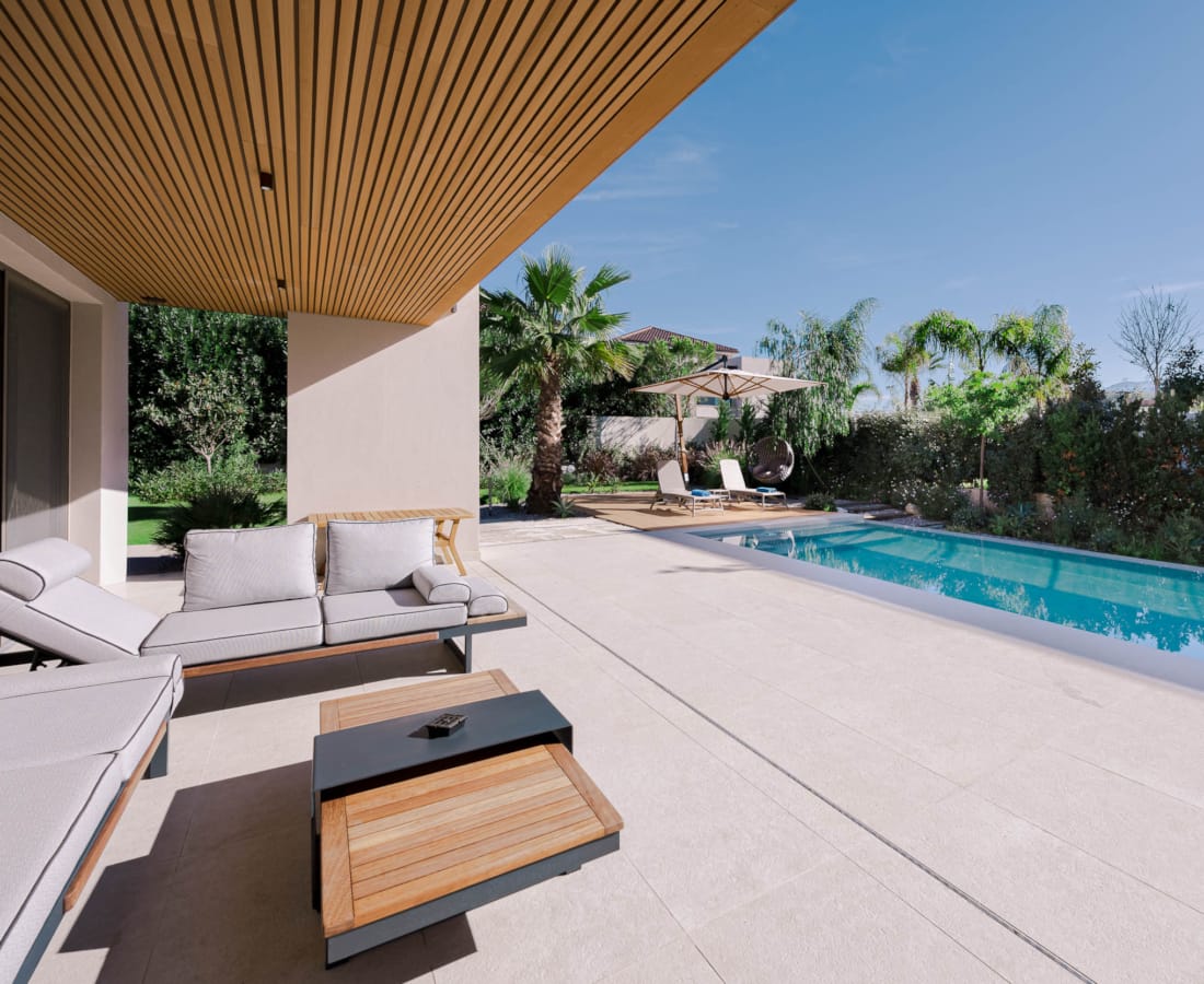 a swimming pool with a lounge chair