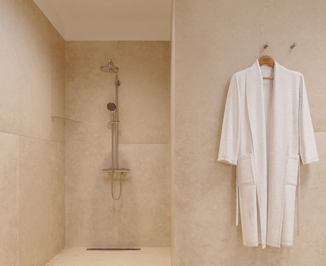 a bathroom with a shower and a sink