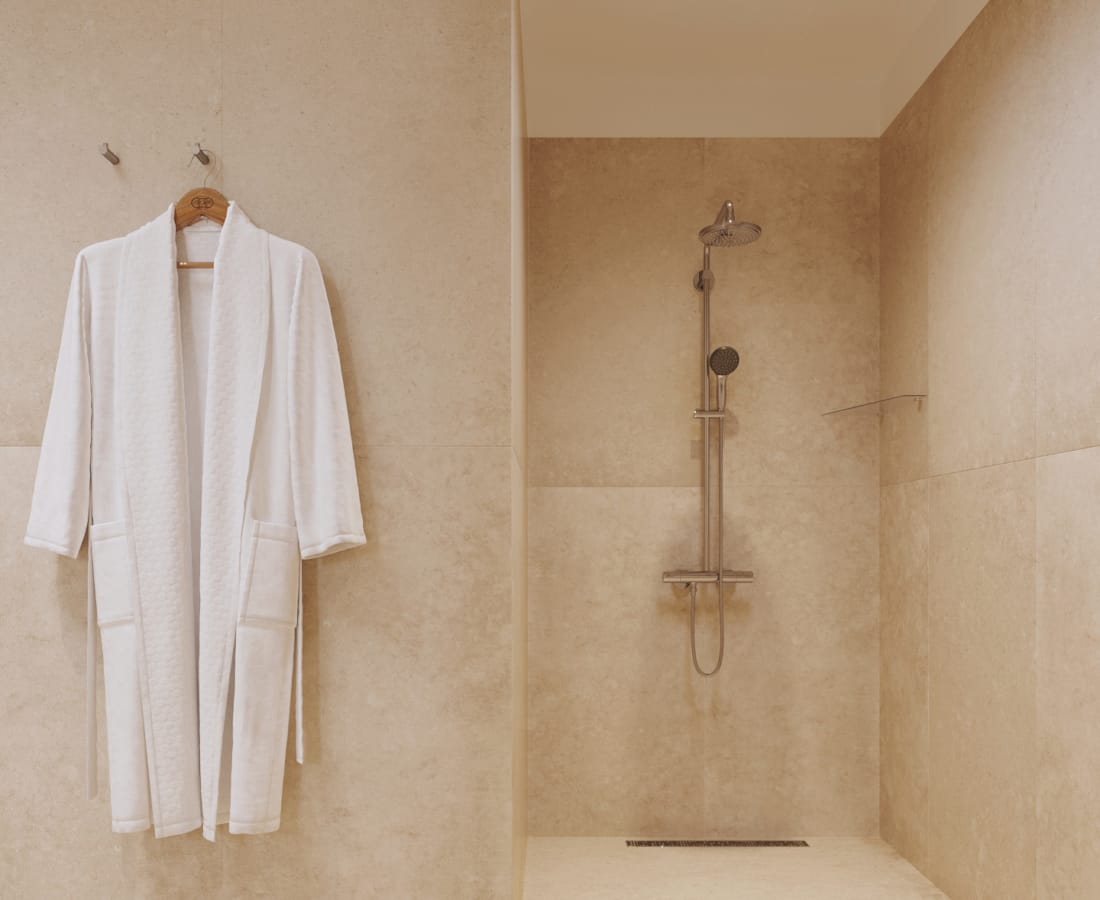 a bathroom with a shower and a sink